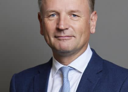 simon stevens in blue suit, pale blue tie and white shirt
